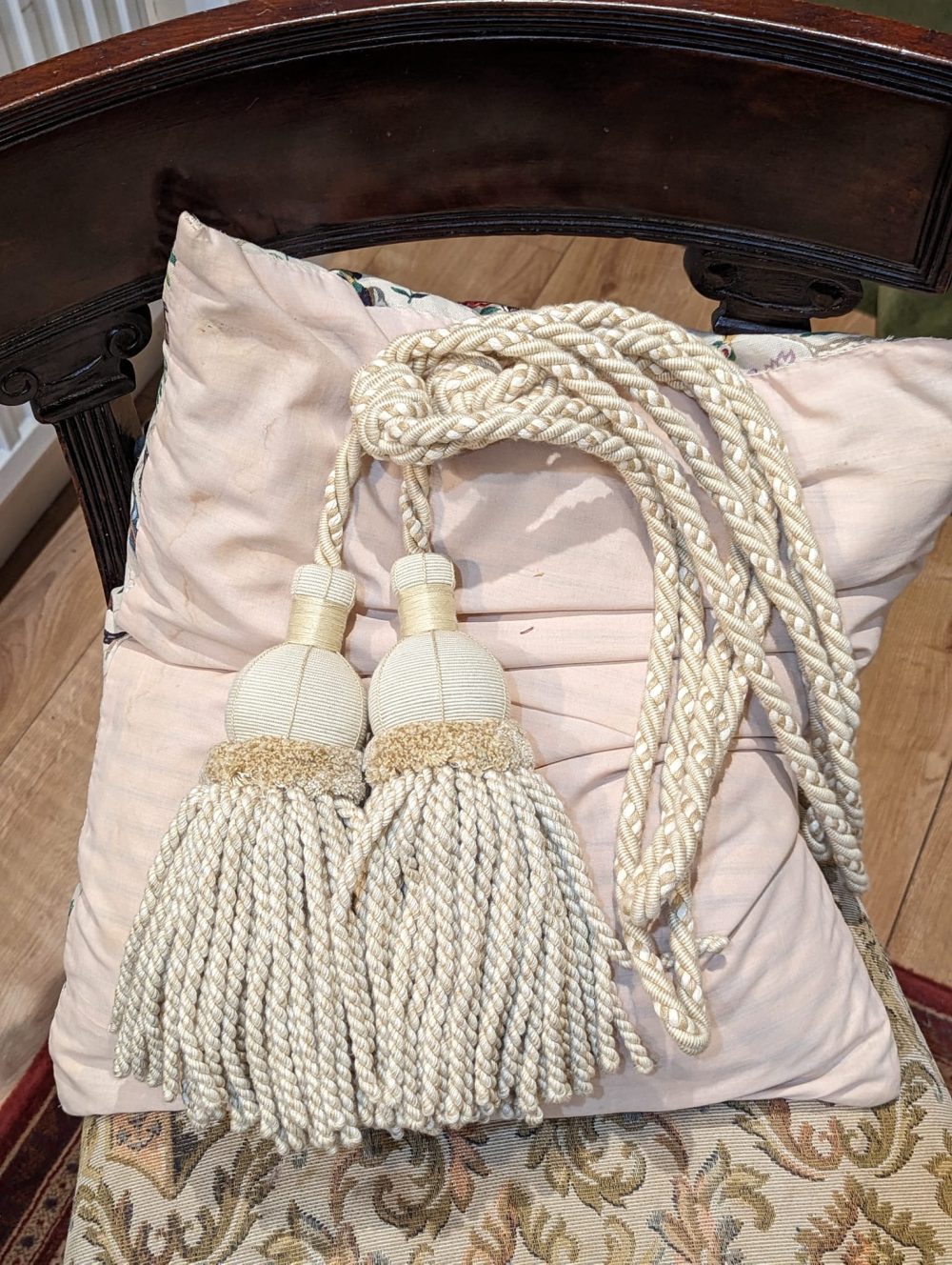 Light cream rope & tassel tiebacks with velvet detailing