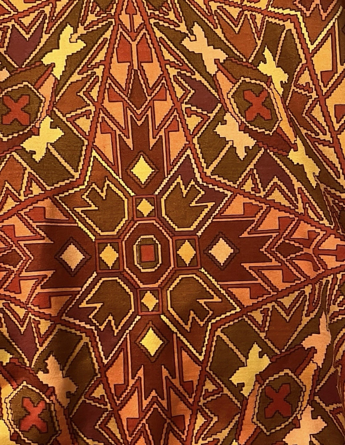akabah3 - Divinely Vintage Interiors Geometric tribal rug pattern in warm reds, browns, and yellows with diamond and zigzag motifs