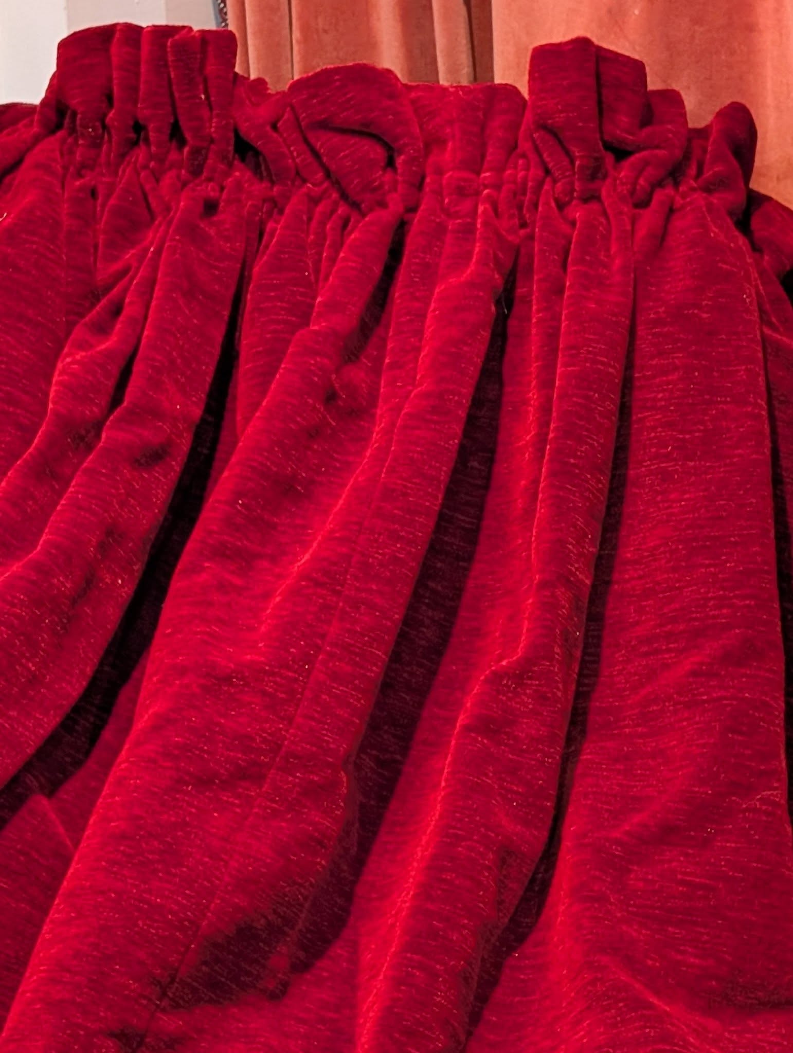 ed4 - Divinely Vintage Interiors Crimson velvet drapery with heavy, cascading folds.