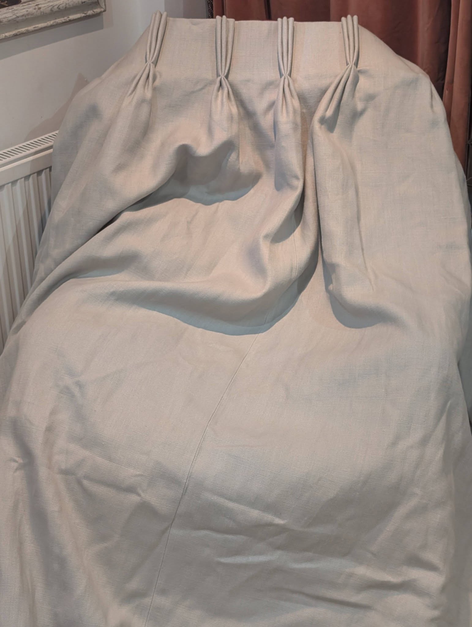 hannah12 - Divinely Vintage Interiors Light gray fabric slipcover with gathered pleats along the top edge, covering a chair or sofa