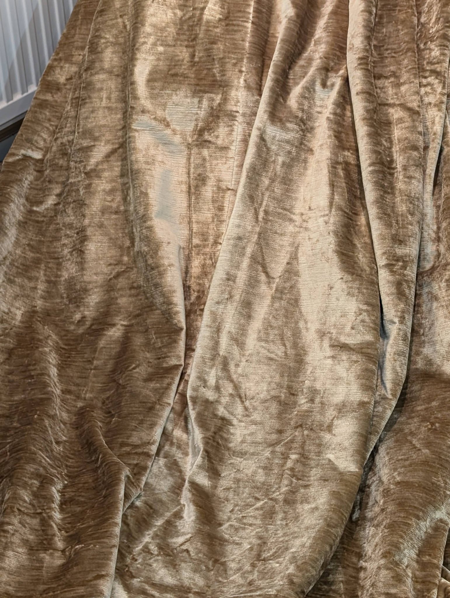 judith2 - Divinely Vintage Interiors Close-up of rich brown velvet drapery with soft folds and sheen.
