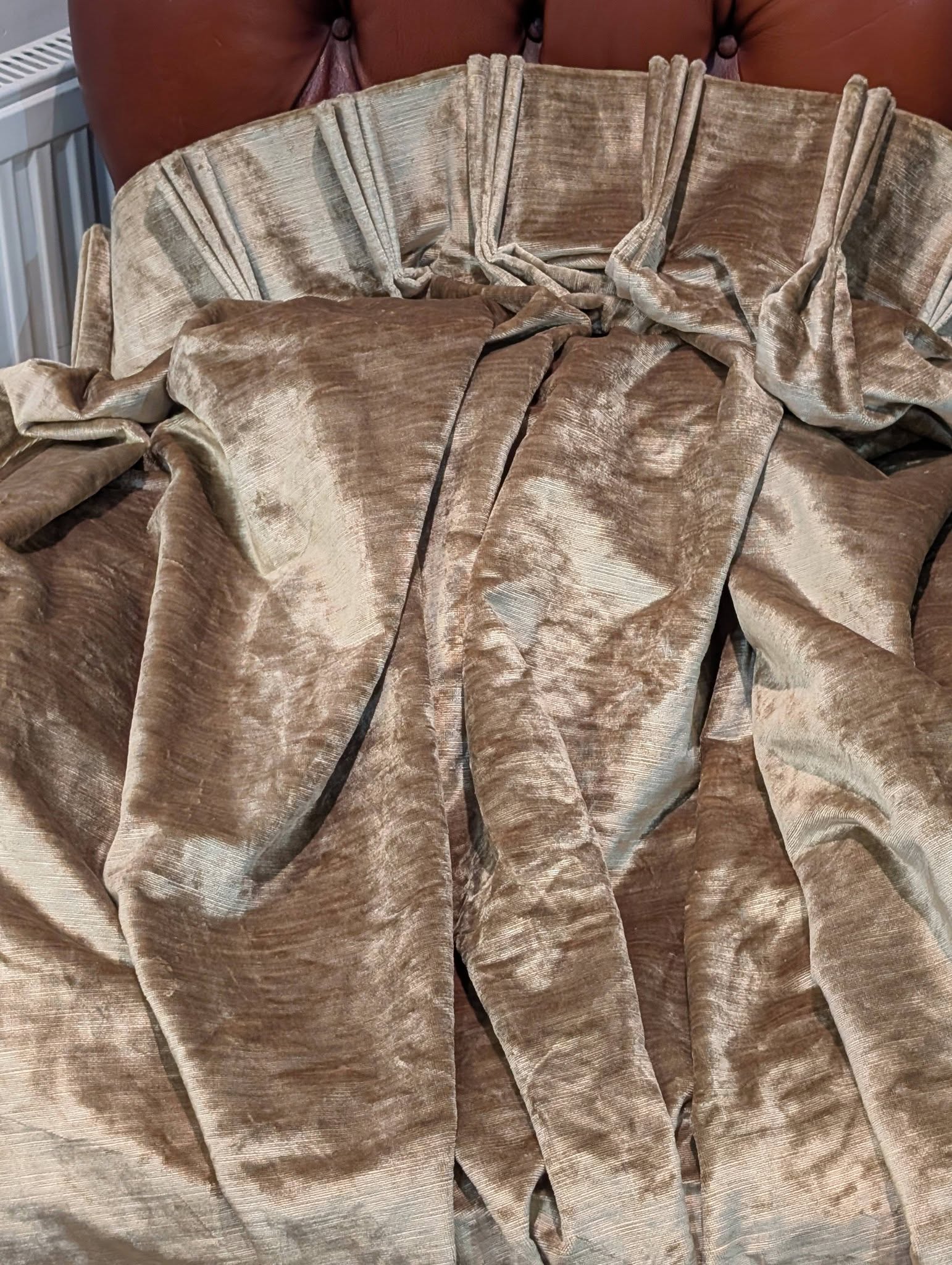 judith8 - Divinely Vintage Interiors Beige velvet curtains pleated and draped, filling the frame with textured folds.